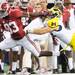 Alabama junior wide receiver Kevin Norwood runs the ball past Michigan sophomore linebacker Desmond Morgan in the second half of the Cowboy Classic at Cowboy Stadium in Arlington, Texas on Saturday. Melanie Maxwell I AnnArbor.com